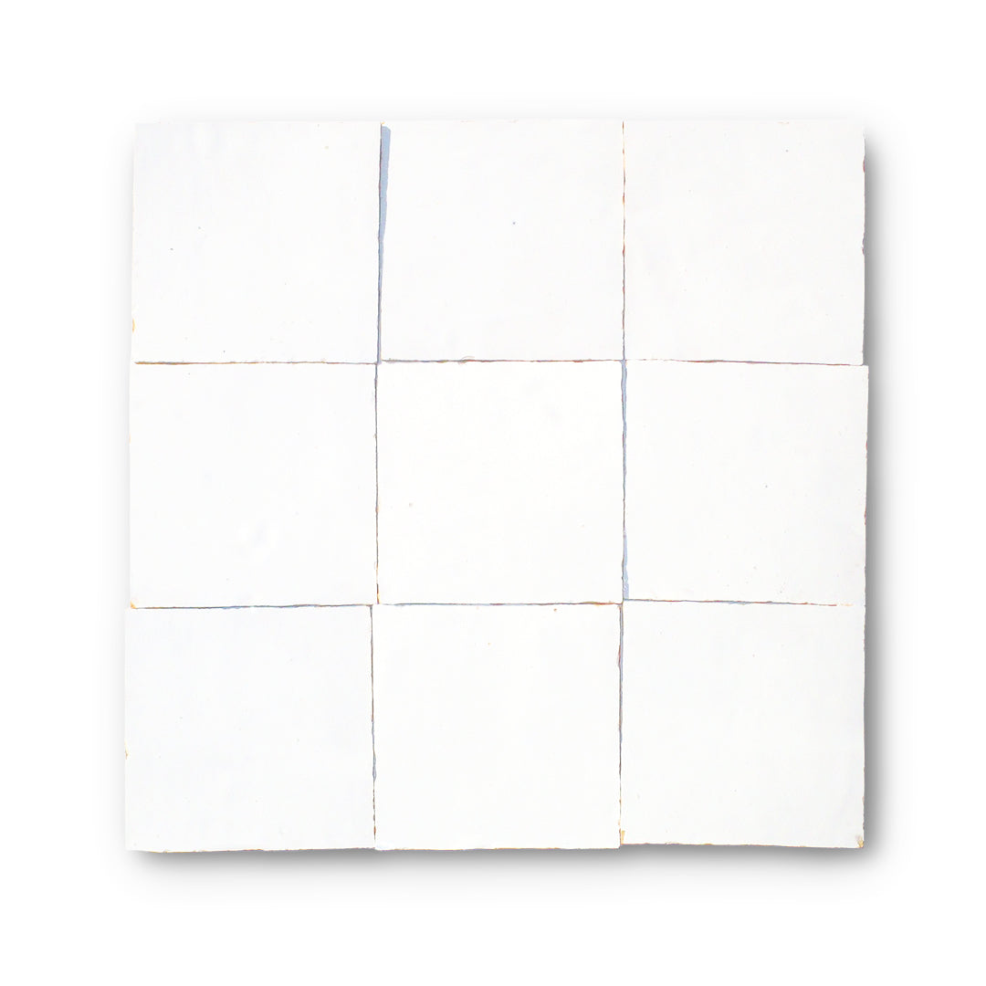 Classic white zellige tile with a handcrafted glazed surface. Slight tonal and edge variations. Recommended for interior wall use.

